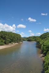 Fototapeta na wymiar 伊作川の河口周辺と夏の青空 