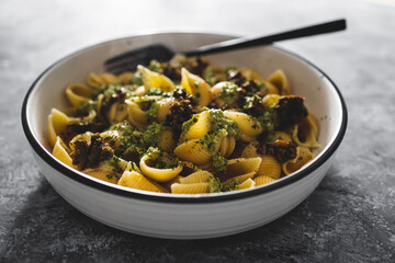 vegan homemde rustic pesto and aubergine shell pasta, healthy plant-based food