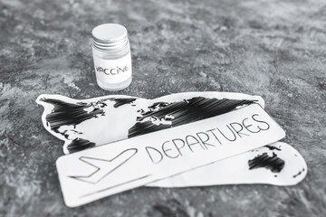 international travel after the covid-19 pandemic, world map with vaccine and departures sign