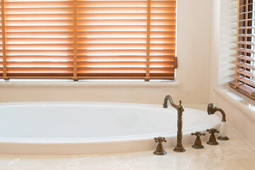 Copper tap of hot and cold water beide bathtub.