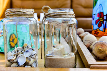 glass jars with sea shells
