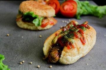 hotdog with tomato sauce and cheese. This image is suitable for making menus and advertisements