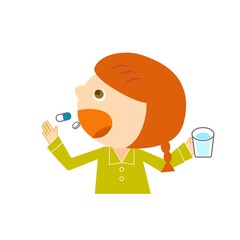 風邪をひいて薬を飲む女の子