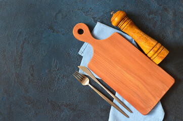 empty cutting board for copy space text and mock up and silver table utensil fork and knife flat...
