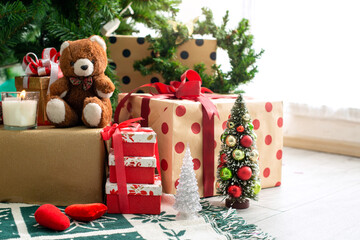 Bear toy presents and gifts under the Christmas tree for Christmas on floor, Family traditional...
