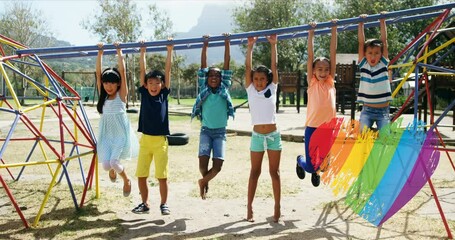 Animation of rainbow heart over diverse children playing on playground