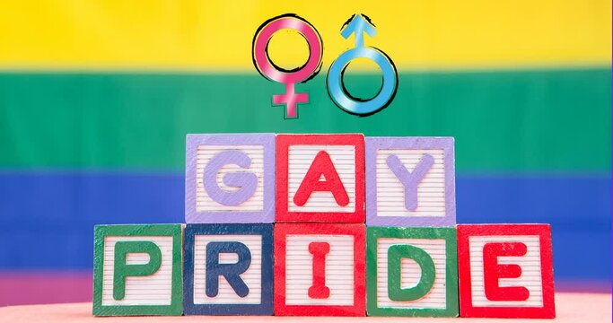 Animation of gay pride on blocks and female and male symbols on rainbow background