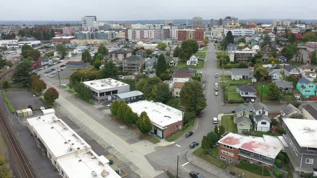 Cinematic 4K aerial drone pan shot of downtown Everett, Bayside, Port Gardner, Naval Station Everett suburbs and bedroom communities North of Seattle on the shores of Puget Sound in Washington