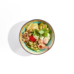 Healthy food - poke bowl with prawn, rice, fresh vegetables, edamame beans, soybean sprouts . Traditional dish Hawaiian cuisine. Poke bowl with shrimp isolated on white background. Dinner for slimming