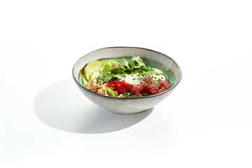Healthy food - poke bowl with tuna, rice, fresh vegetables and Hawaiian sauce. Hawaiian meal poke bowl with tuna isolated on white background. Dinner for slimming.