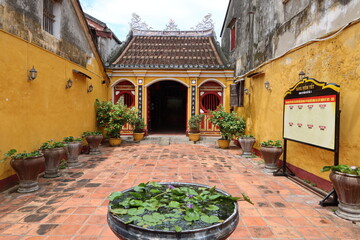 Fototapeta na wymiar Hoi An, Vietnam, October 10, 2021: View from the entrance courtyard of the Hy Hoa temple in Hoi An, Vietnam