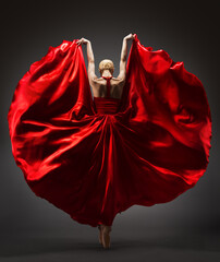 Ballerina Dancing in Red Flying Dress Rear Back Side View. Graceful Woman Ballet Performer in Flamenco Skirt. Expressive Passion Dance in Motion over Dark Background - obrazy, fototapety, plakaty