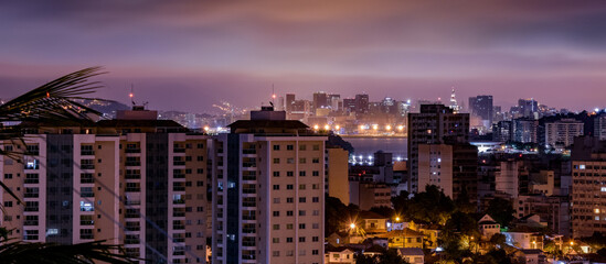 Fototapeta na wymiar Niterói, Rio de Janeiro, Brazil - CIRCA 2021: Long exposure urban night photography with buildings and lights of a Brazilian city