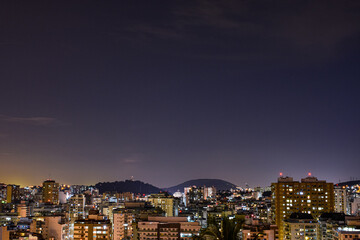 Obraz premium Niterói, Rio de Janeiro, Brazil - CIRCA 2021: Long exposure urban night photography with buildings and lights of a Brazilian city