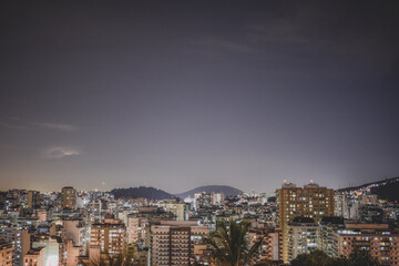 Naklejka premium Niterói, Rio de Janeiro, Brazil - CIRCA 2021: Long exposure urban night photography with buildings and lights of a Brazilian city