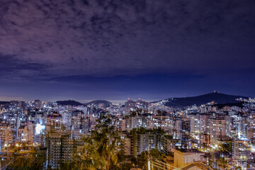 Obraz premium Niterói, Rio de Janeiro, Brazil - CIRCA 2021: Long exposure urban night photography with buildings and lights of a Brazilian city