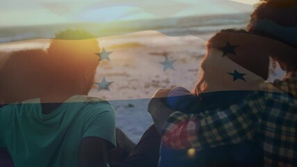 Animation of waving flag of honduras over group of friends having fun on the beach - Powered by Adobe