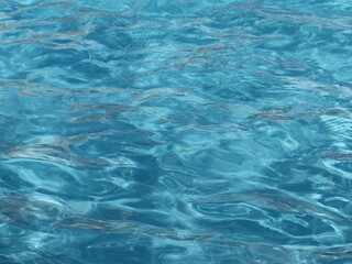 Fototapeta na wymiar Blue moving water in the pool