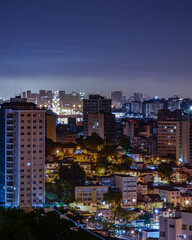 Naklejka premium Niterói, Rio de Janeiro, Brazil - CIRCA 2021: Long exposure urban night photography with buildings and lights of a Brazilian city