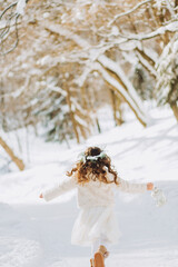 Amazing little girl holding Christmas lantern outdoors on beautiful winter sunny day