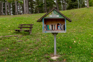 A small wooden public library, in a public park in Lizzano in Belvedere, Bologna, Italy