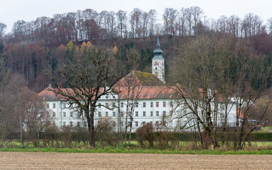 View on Schäftlarn Abbey during autumn season. A benedictine monastery located in upper bavaria.