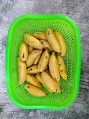 pile of small bananas on basket