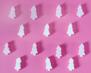 
Christmas background with food, marshmallows in the shape of a Christmas tree. On a pink background