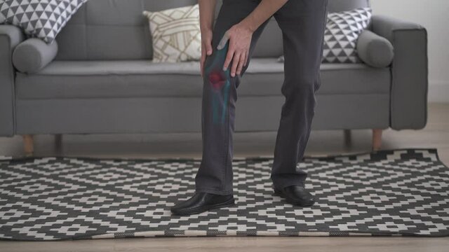 Knee pain, man suffering from osteoarthritis at home, chiropractic treatments concept