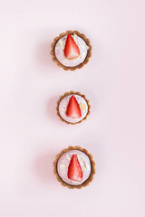 three healthy diet cakes on a pink background top view