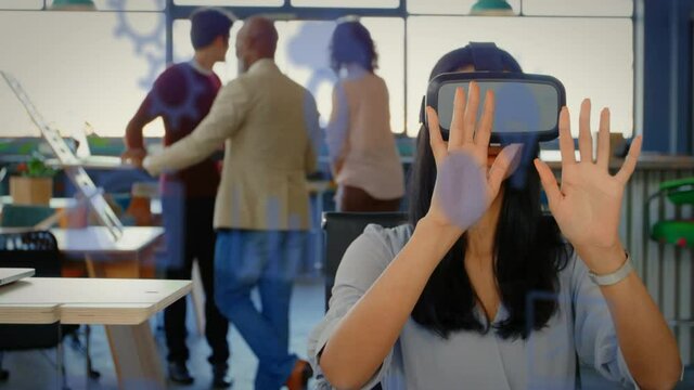 Animation of social media icons over mixed race woman wearing vr headset