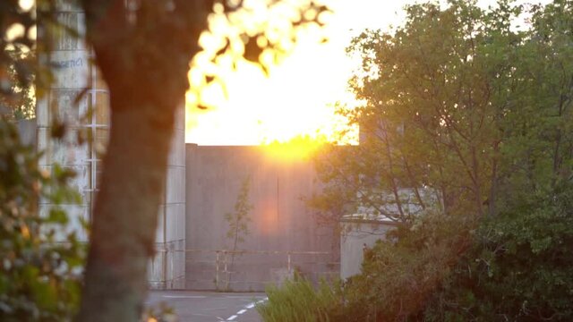 The clip shows a sundawn next to an abandoned hotel.