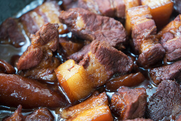 Close-up of braised pork cooked in a pan