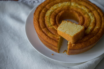 Fototapeta na wymiar Homemade rustic cake on a wooden table. Traditional recipe
