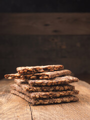 Stacked organic crispbread on a rustic wooden table