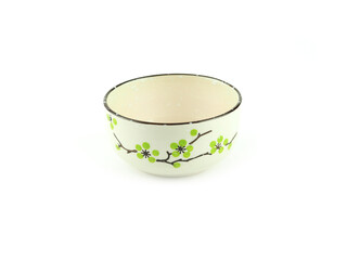 Empty beige ceramic bowl with brown rim and green flora pattern isolated on a white background. Used serving for home or restaurant, food design. Kitchen accessory..