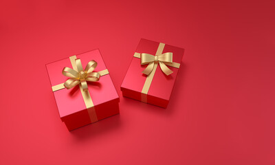 Gifts box with golden ribbon on red background.
