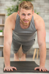 closeup of a motivated young man doing push ups