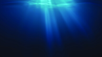 Sun rays and light shining through surface of ocean seen from underwater. © vchalup