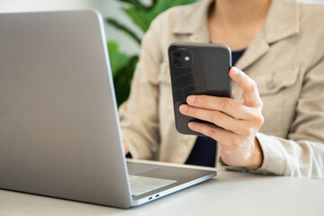 work using texting cell phone typing computer.student study education online learning.adult professional chatting on laptop,mobile contact us at Thinking business plan.connecting people concept