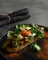 bruschetta with cottage sheese and cucumber slice, avocado, poached egg