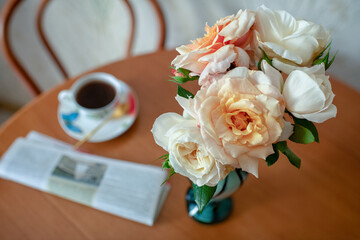 Photography to theme beautiful bouquet roses in vase on wooden table