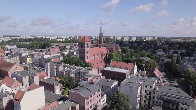 Torun, a Polish city during the day. A sunny and slightly cloudy day in Toruń on the Vistula River.