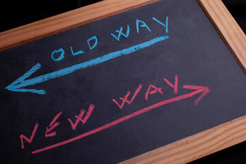 Old way or new way written on chalkboard