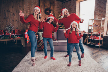 Full length body size view of beautiful handsome cheery carefree family dancing having fun advent at decorated loft home indoors