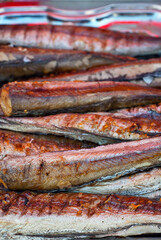 Fried seafood on the table. Many varieties of seafood at the festival. Fried fish with lemon.