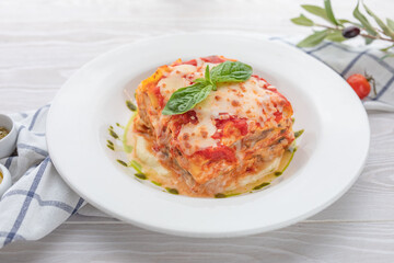 pasta baked with cheese, minced meat and cream sauce