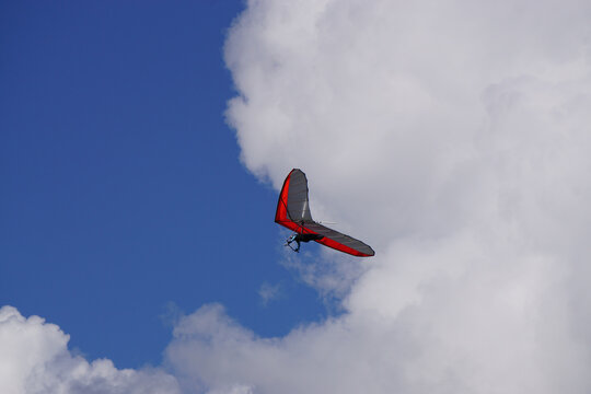 handglider in the clouds