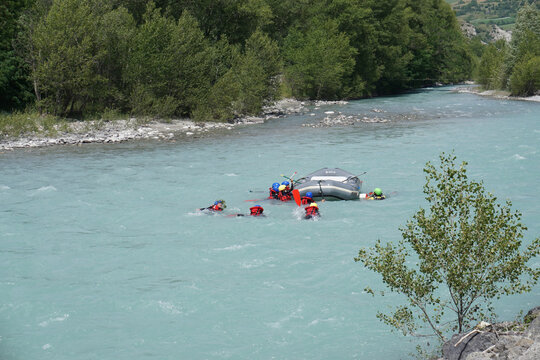 rafting on the river durance alps france with overboard people in water