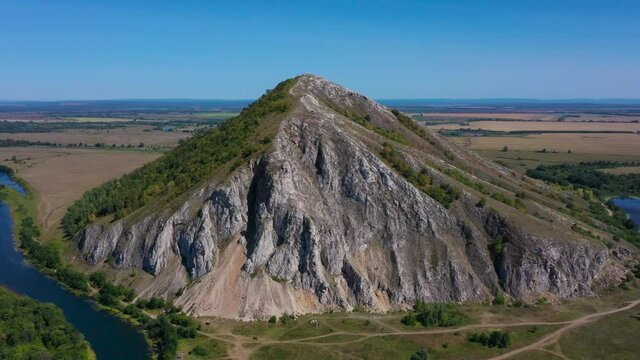 Shikhan Yuraktau - The remain of the reef of the ancient sea, composed of limestone . Indian summer in the floodplain of the Belaya River. Aerial view.